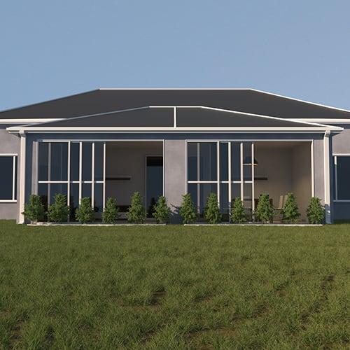 A view from a grassy back yard that shows a house with a florida room addition with screen and glass windows.